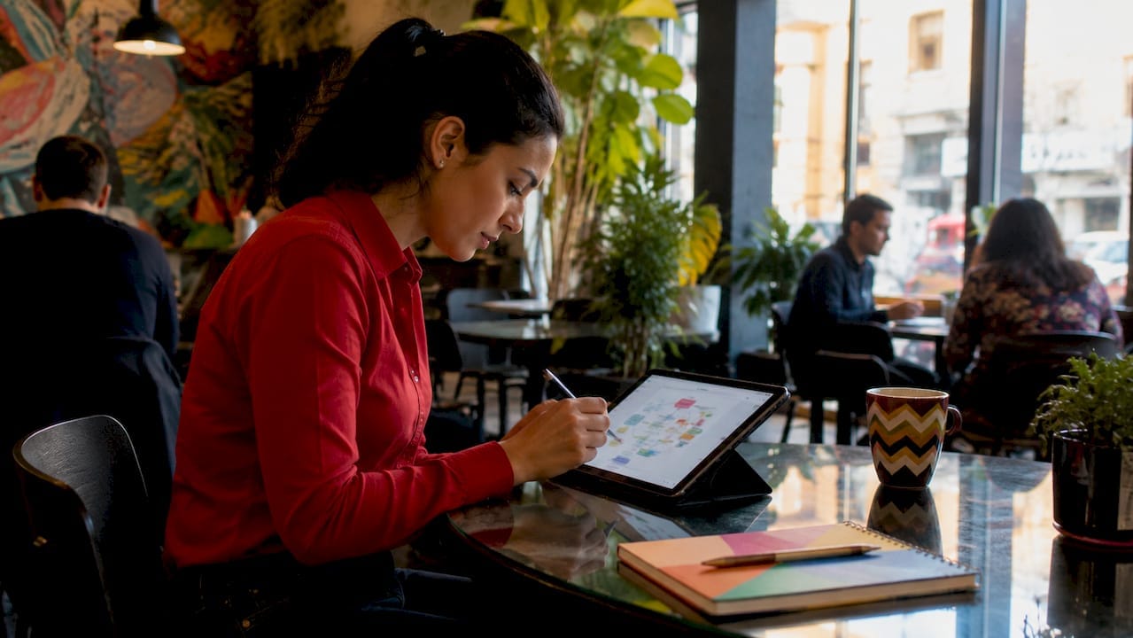 Hands mapping shopper journey on tablet digital device