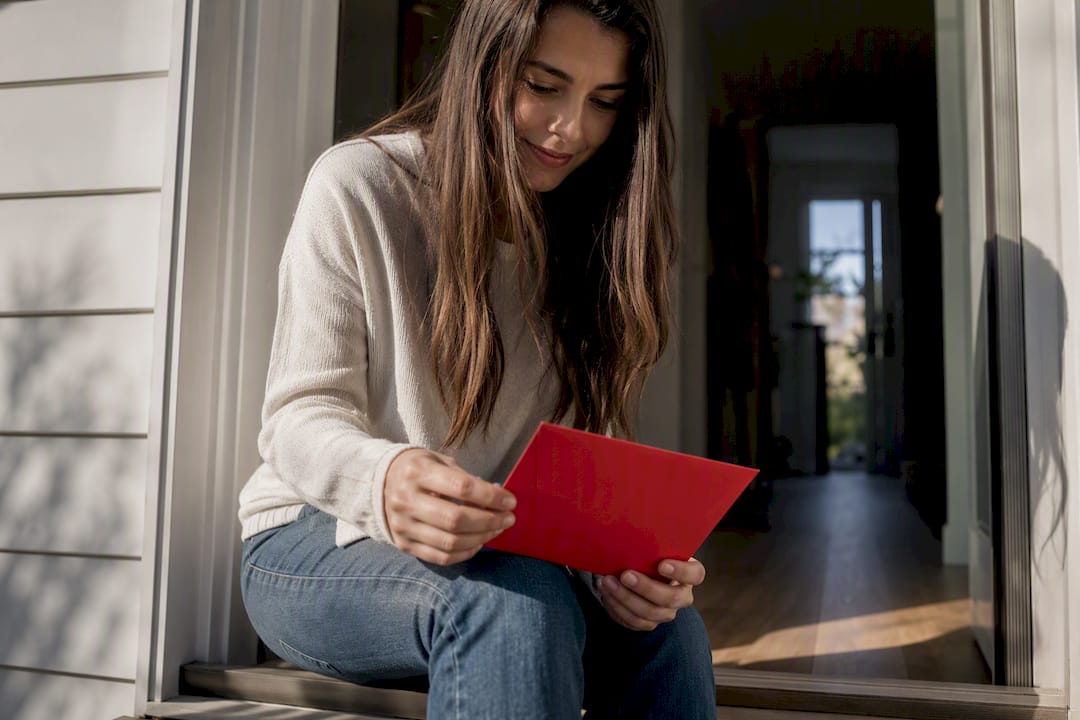 New homeowner retrieving welcome mailer